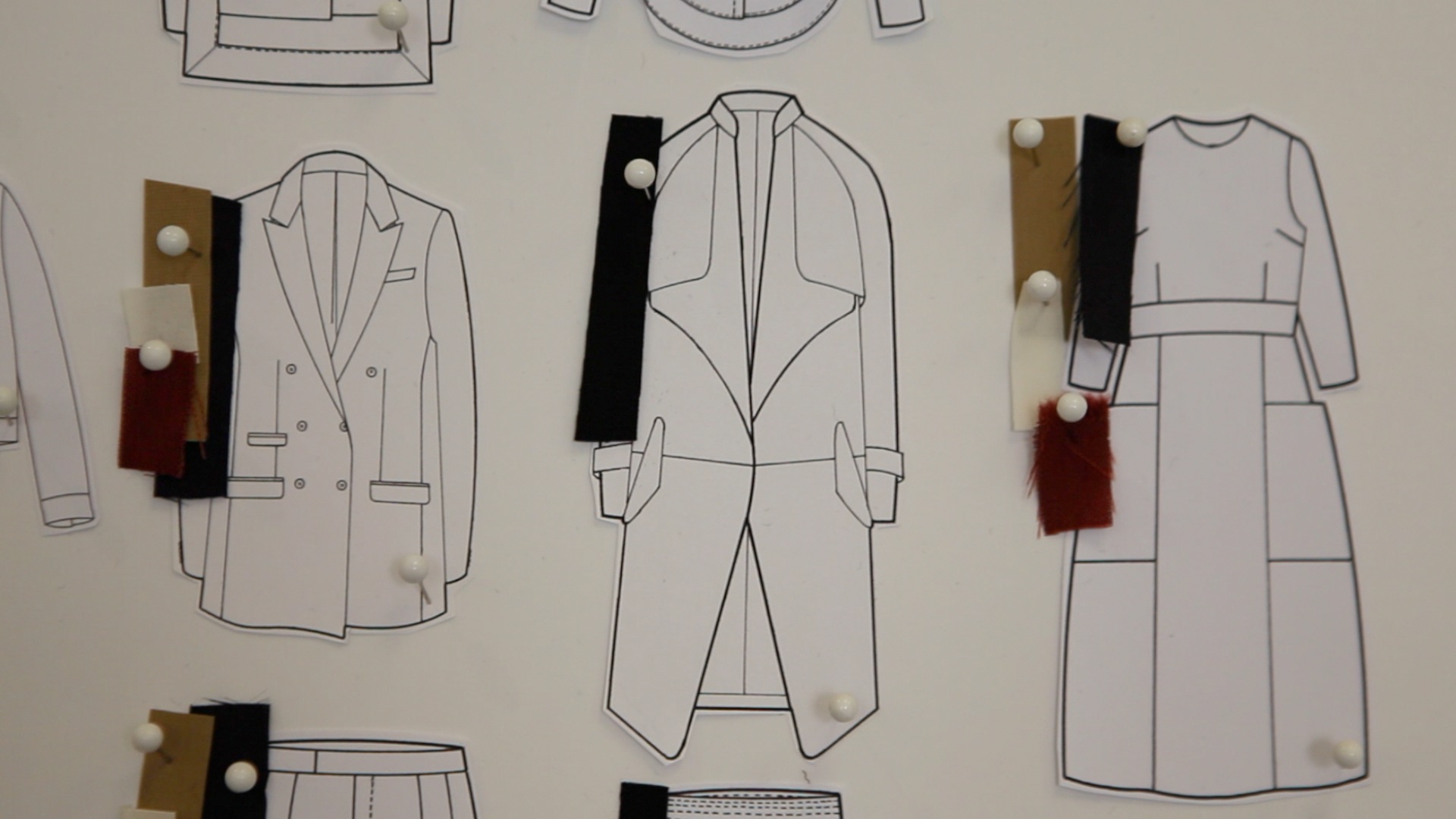 Sketches of fashion designs with fabric samples.