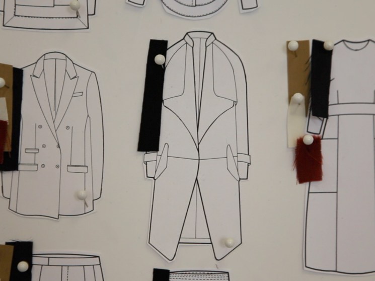 Sketches of fashion designs with fabric samples.