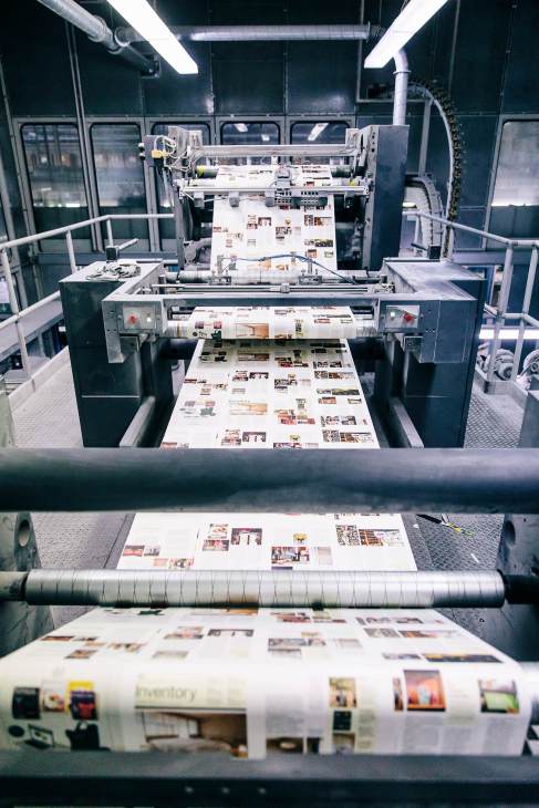 Magazine pages printing on industrial press with Inventory section visible on output