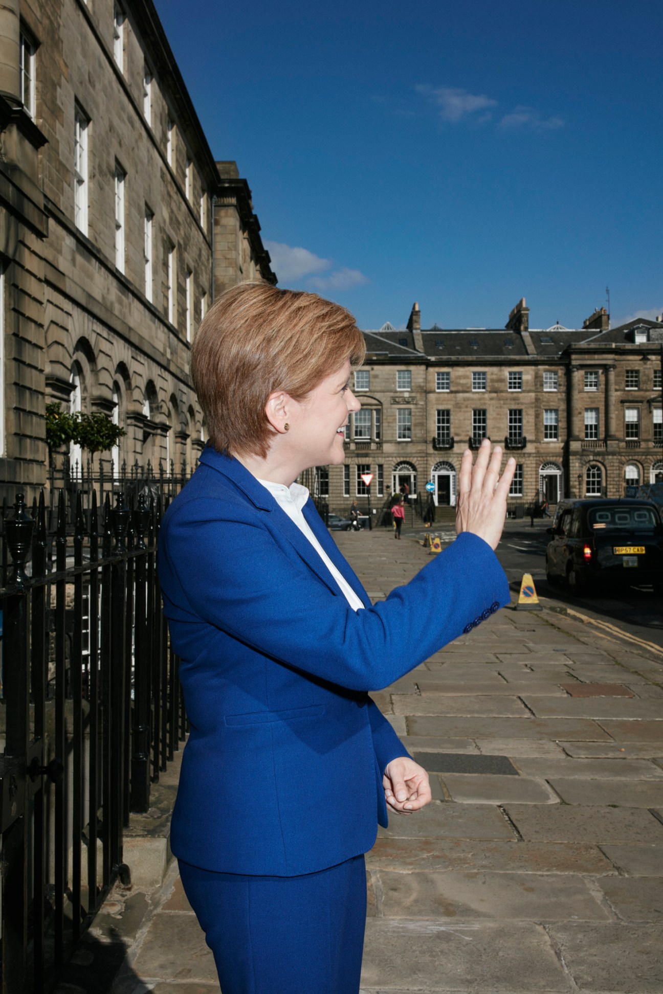 Nicola Sturgeon waving to admirers outside Bute House in Edinburgh, Scotland.