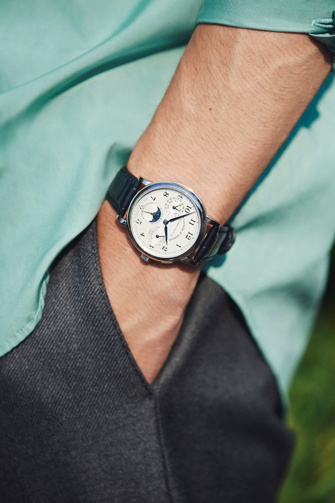 Model in business casual outfit with shirt, trousers and luxury watch