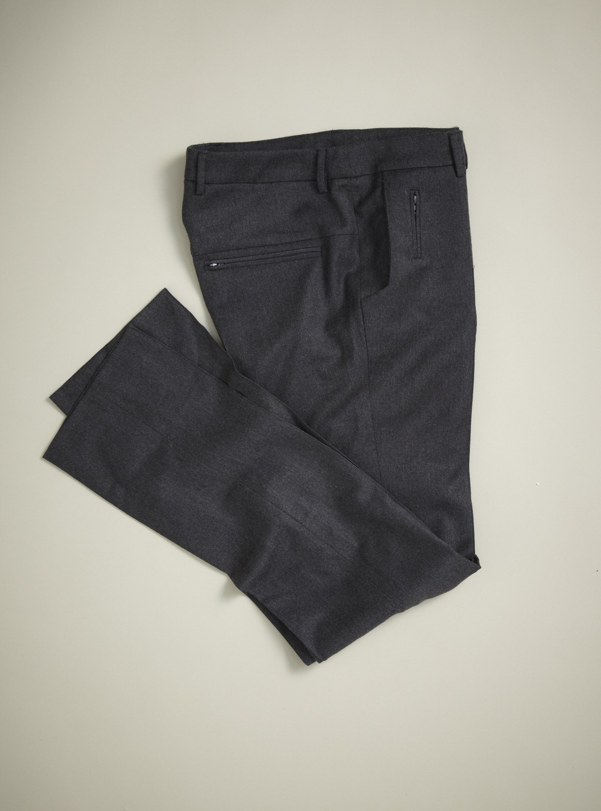 Charcoal wool-cotton blend trousers folded flat against a neutral background.