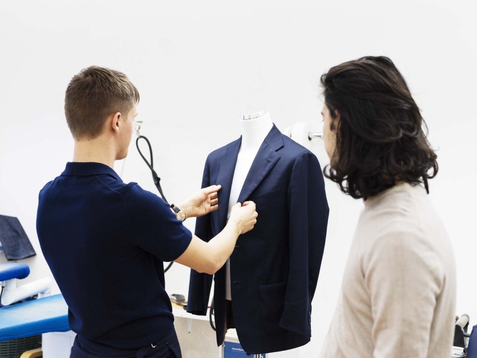 Interior view of Atelier Saman Amel's Stockholm showroom with tailored garments displayed