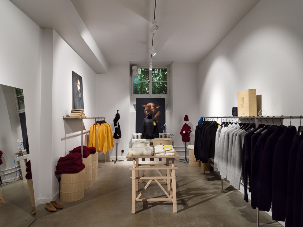 Interior of John Sterner shop-in-shop in Stockholm displaying knitwear on racks and displays