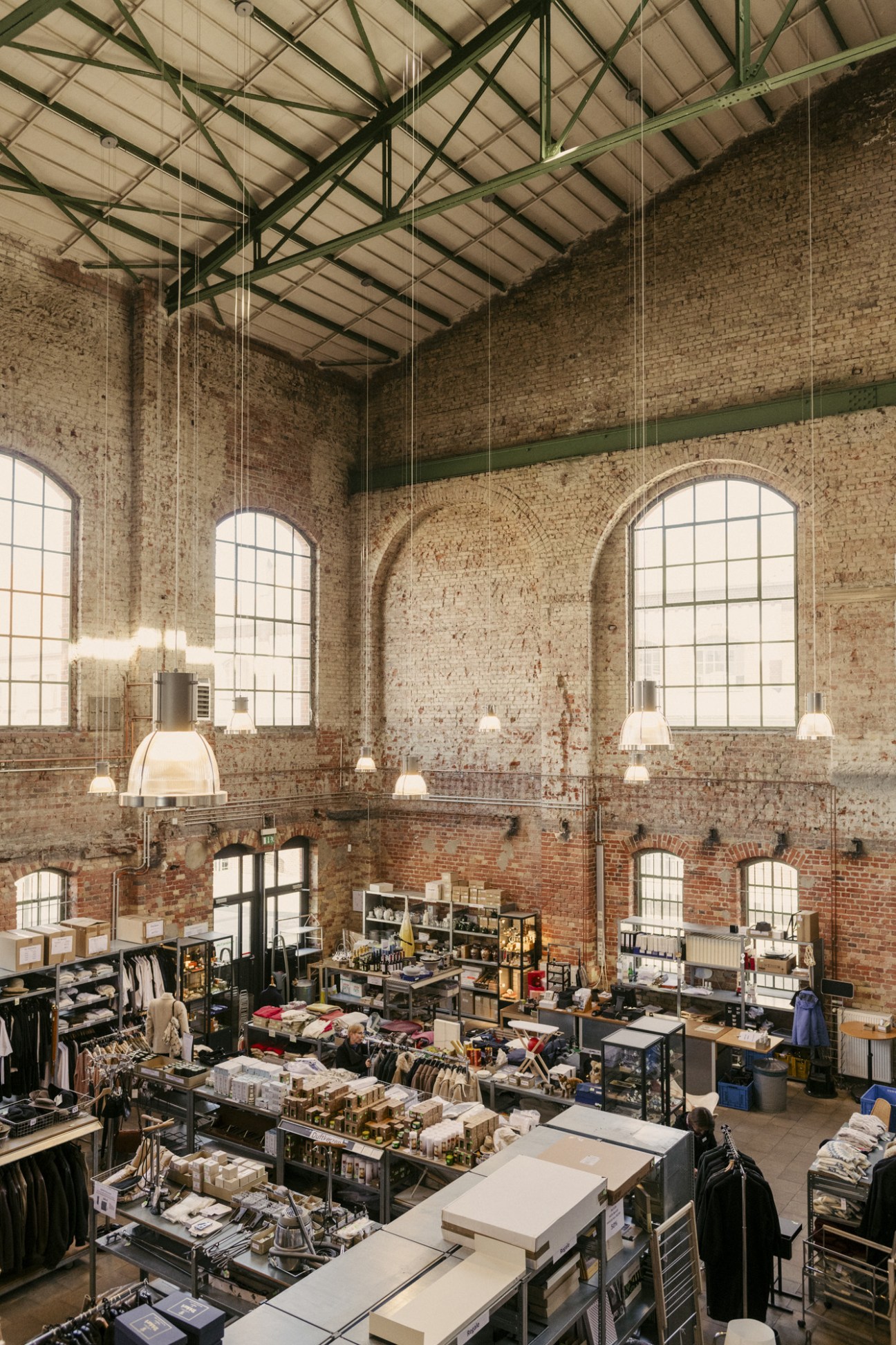 Interior view of Manufactum's retail shop within the converted colliery building showing merchandise displays and shelving.