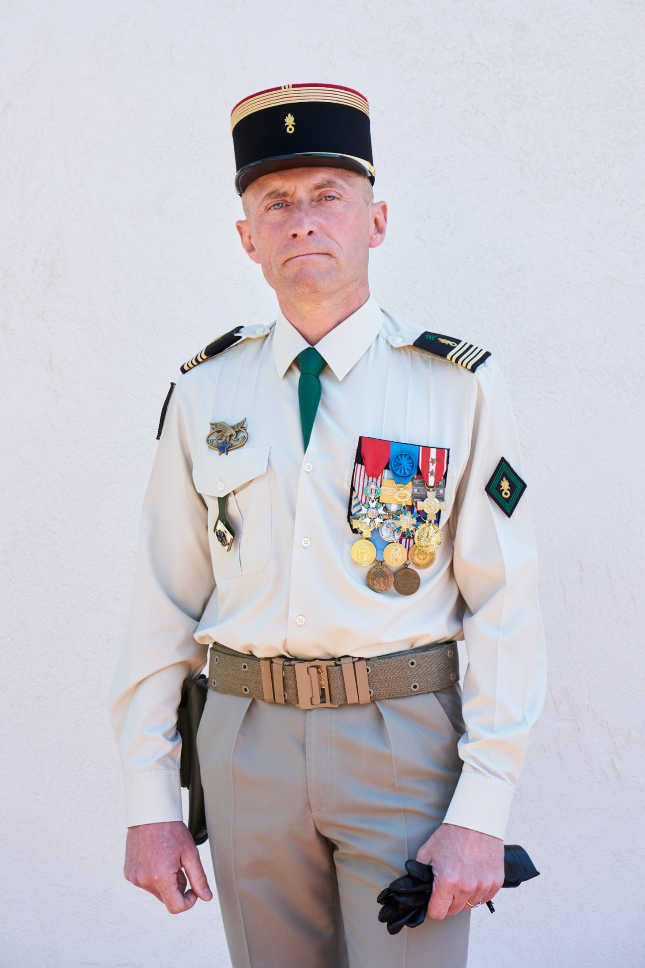Colonel Dujon in white dress uniform with military decorations and medals, commanding officer of 1st Régiment Étranger.