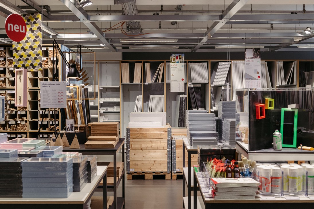 Modulor stationery shop interior with organized shelving, art supplies, and bright retail displays.