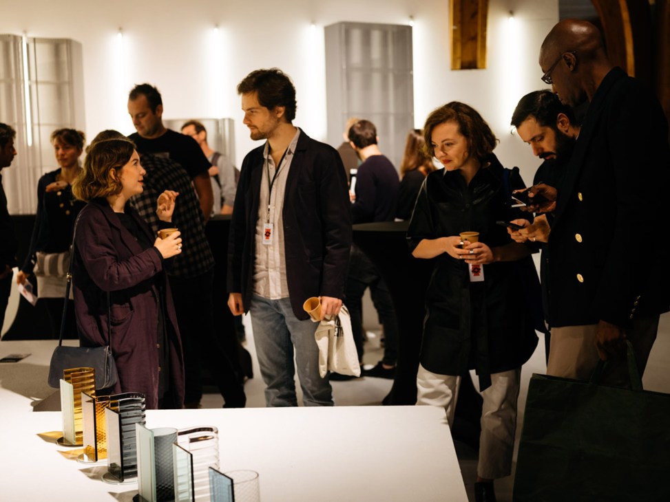 Visitors exploring design installations and exhibits at Biennale Interieur design fair