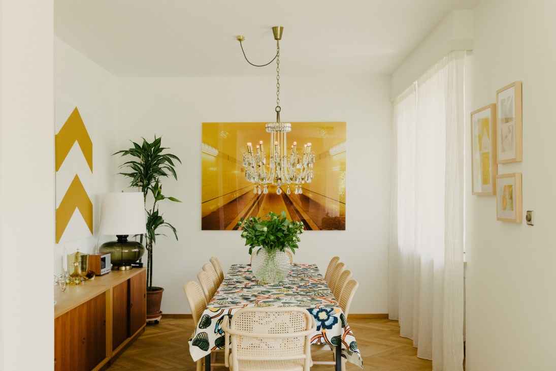 Dining room with Marimekko tablecloth, Thonet chairs, vintage Lobmeyr chandelier and David Willen photograph.