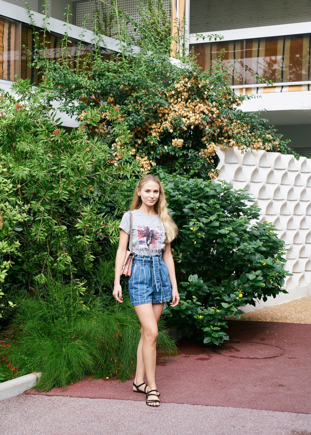 Russian resident Irina Hincu - young lady standing in front of green tree