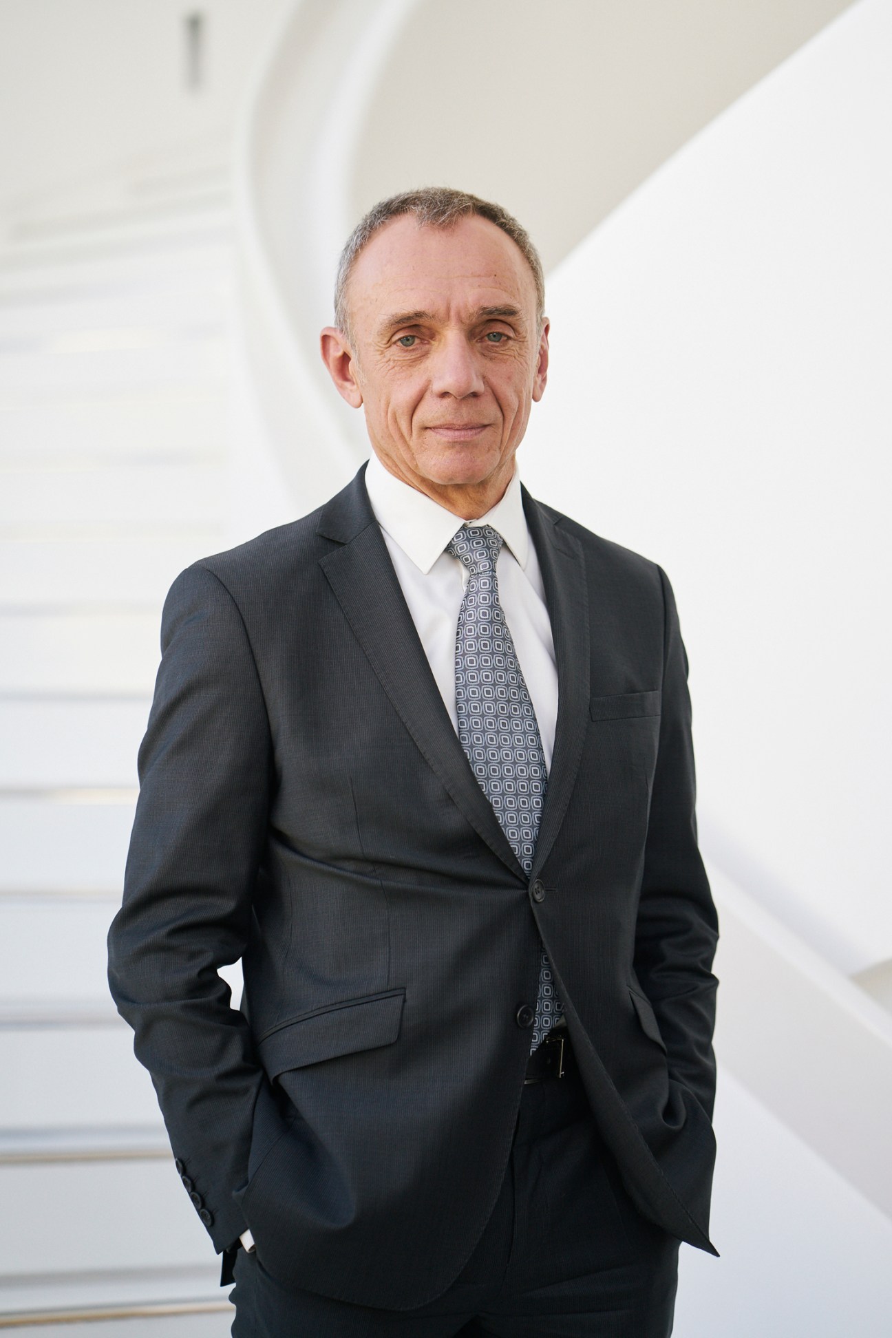 Alain Maingreaud, president of Tax Free World Association, in dark business suit and patterned tie