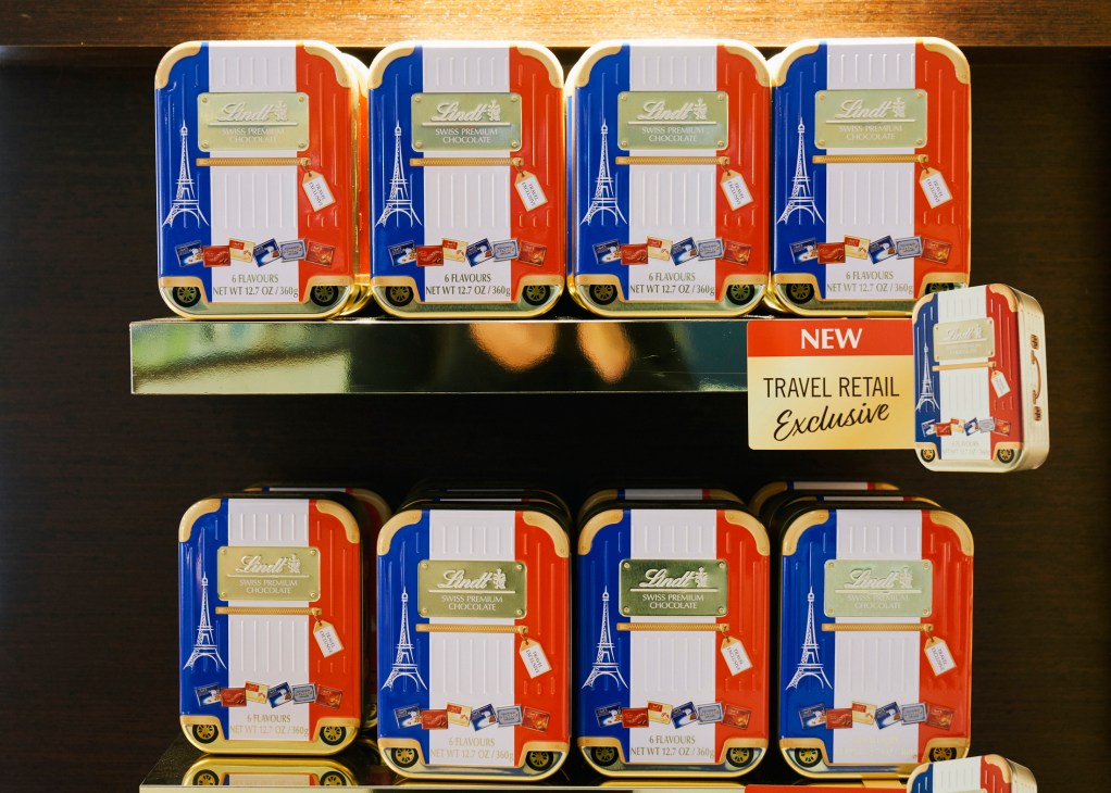 Lindt Swiss premium chocolate travel retail tins with French flag design and Eiffel Tower imagery