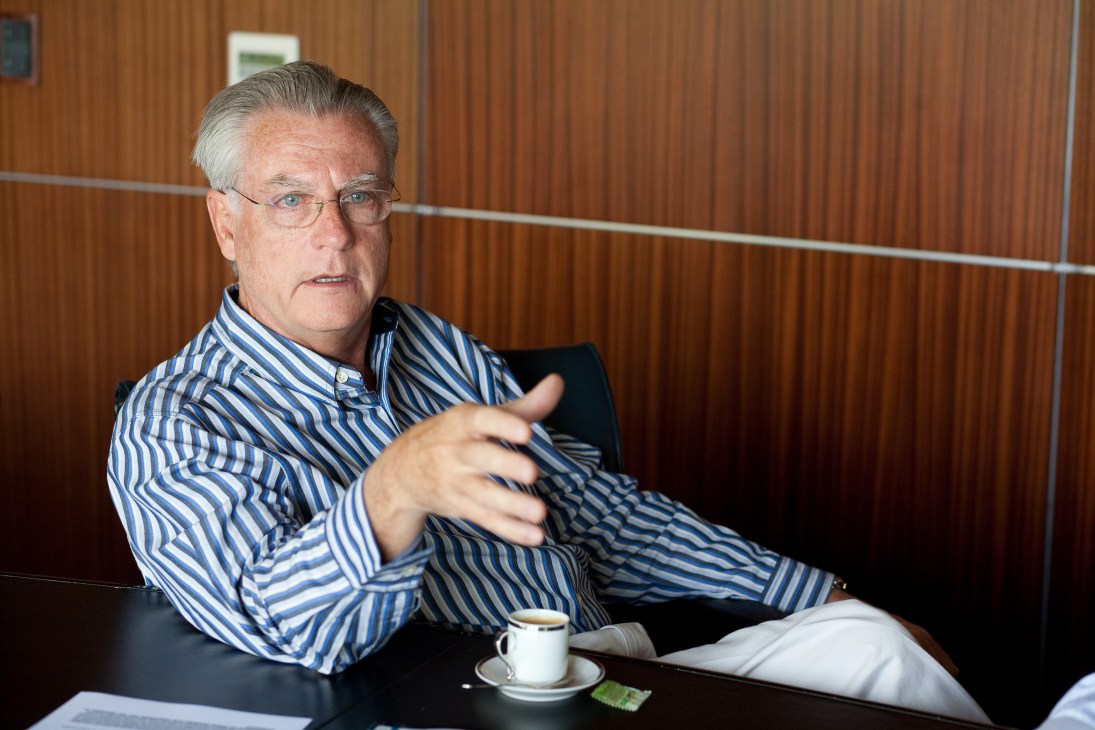 Zonamerica president Orlando Dovat speaks during an interview in a wood-paneled office.