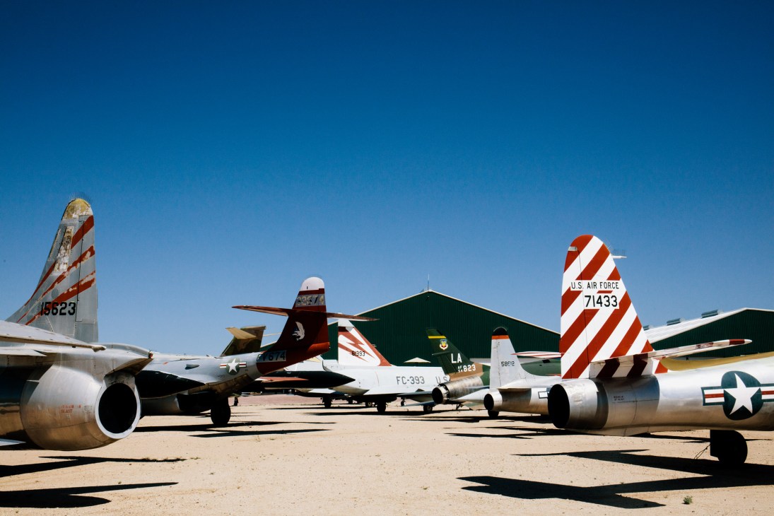 Retired military aircraft lined up in the desert at Pima Air and Space Museum's aircraft boneyard in Tucson.