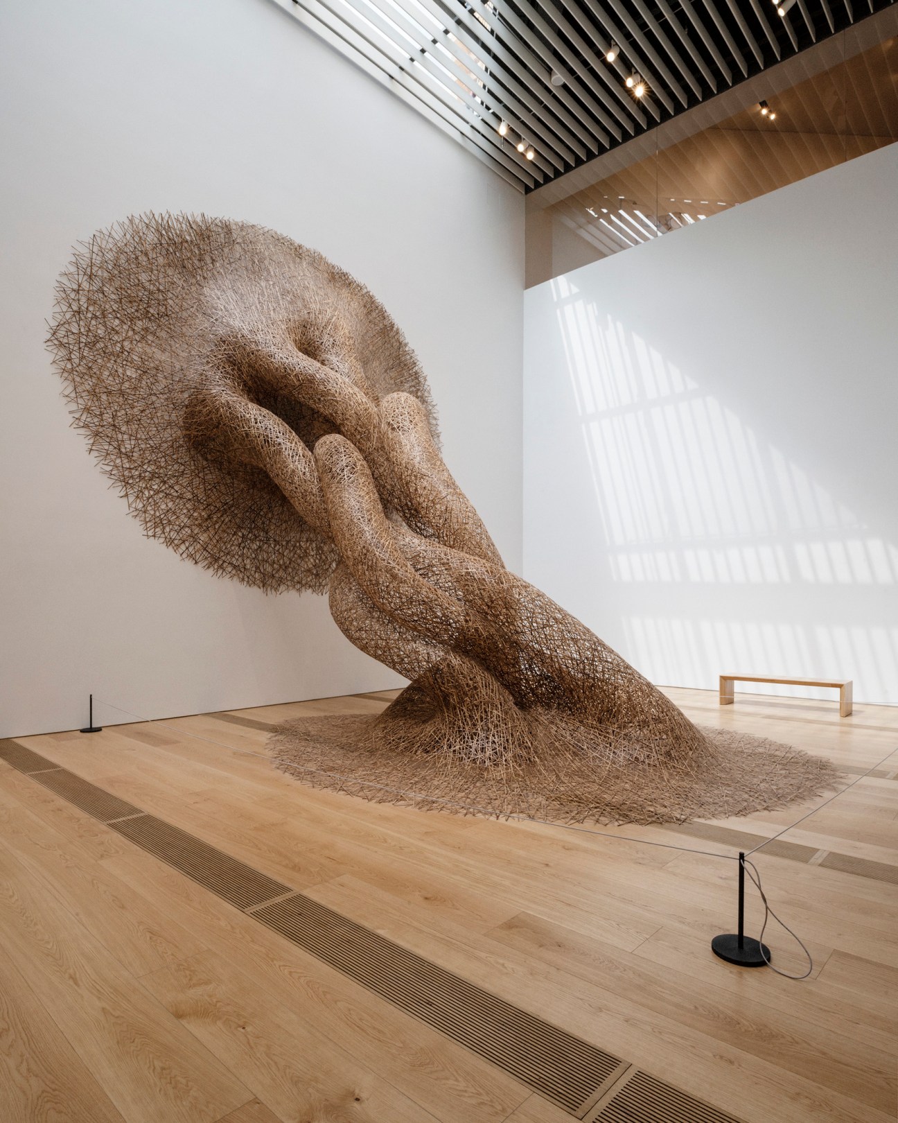 Large-scale woven bamboo sculptural installation by Japanese artist Tanabe Chikuunsaid IV in museum gallery space.