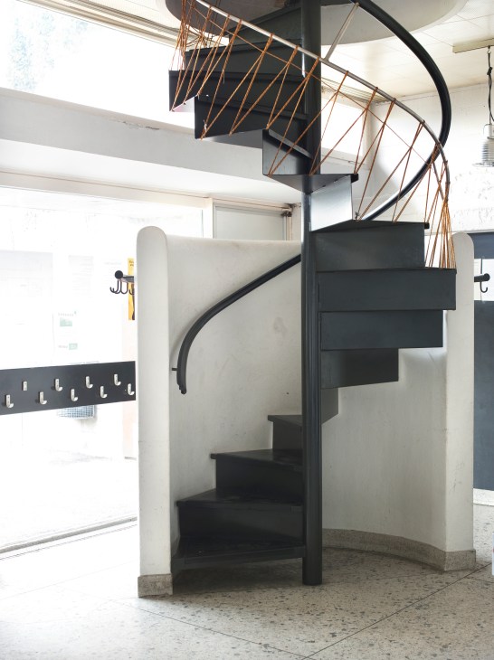 Interior staircase in the community hall showing modernist concrete design
