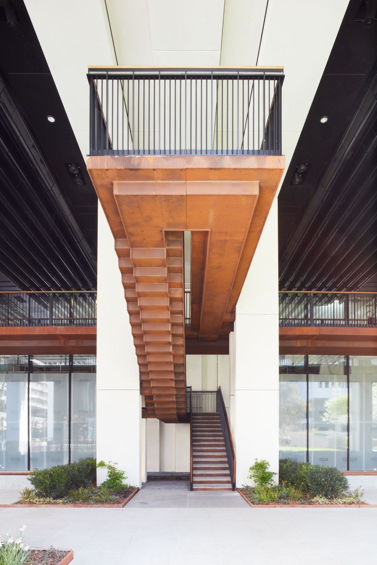 Suspended staircase leading to an elevated walkway at London Wall Place