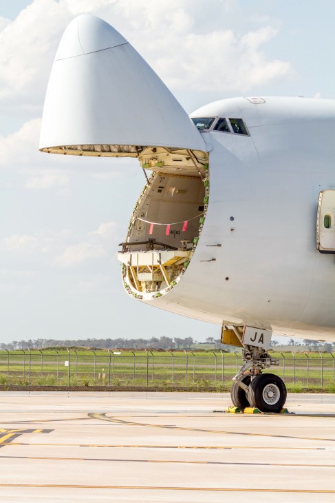 A cargo plane with its nose door open at Wellcamp Airport in Toowoomba, Australia.