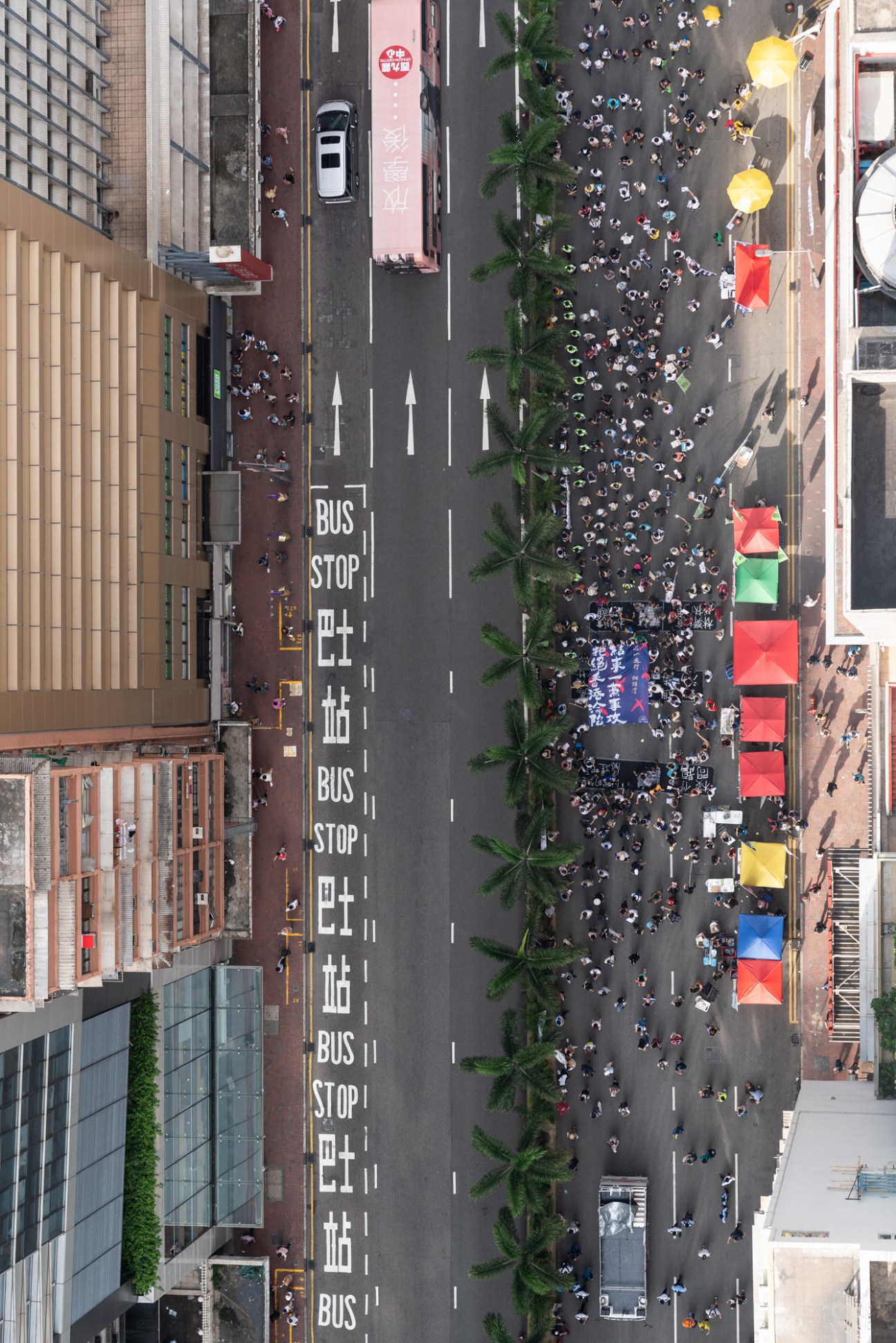 Aerial view of thousands of protesters marching along Hennessy Road in Hong Kong's Wan Chai district.