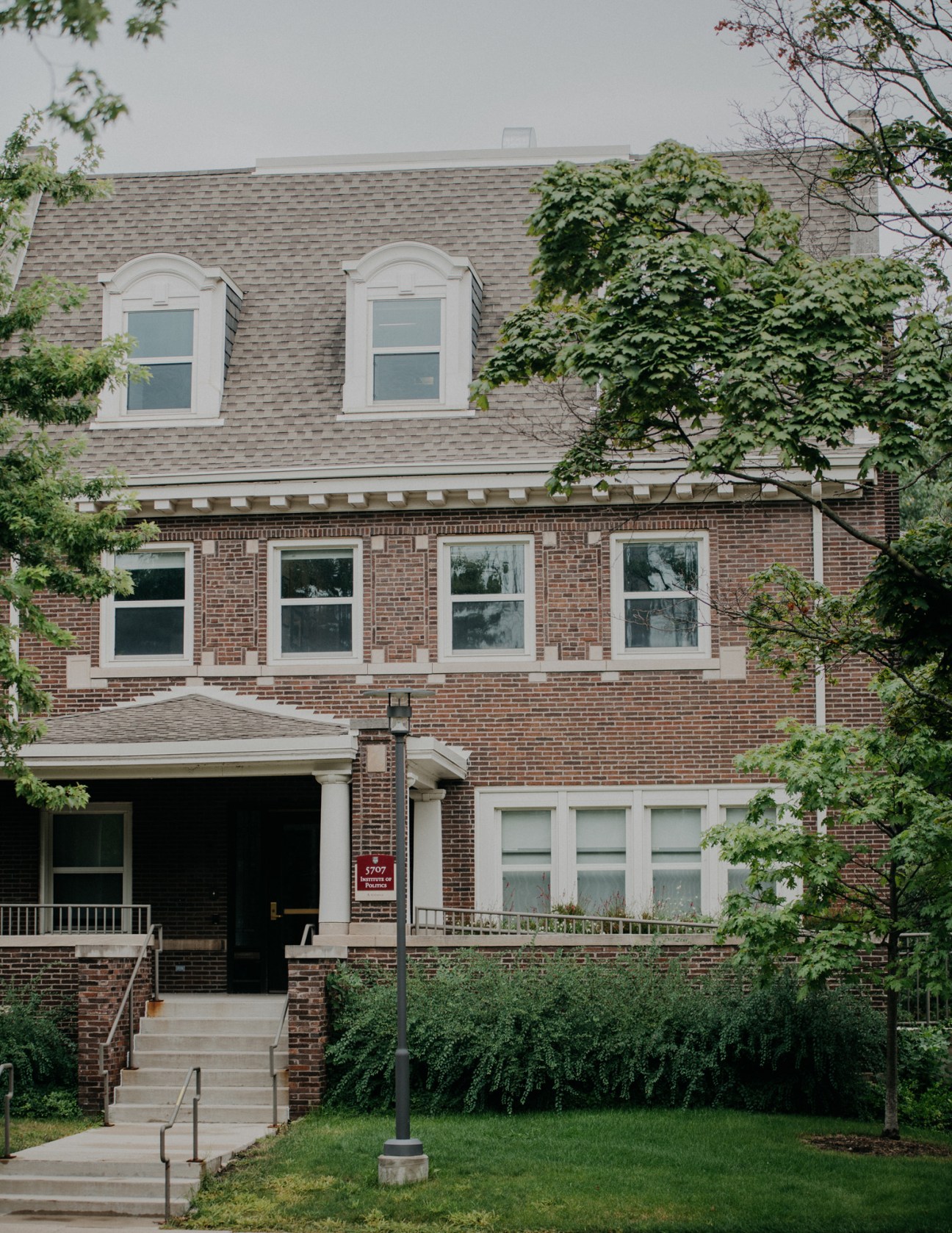 Brick residential building with dormer windows and ivy, Obama family home in Hyde Park, Chicago.