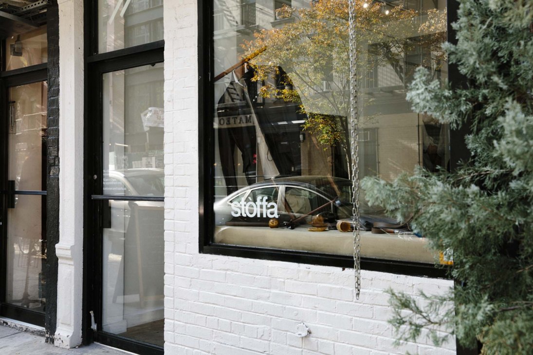 Exterior view of Stòffa trunk show venue with modern minimalist storefront design