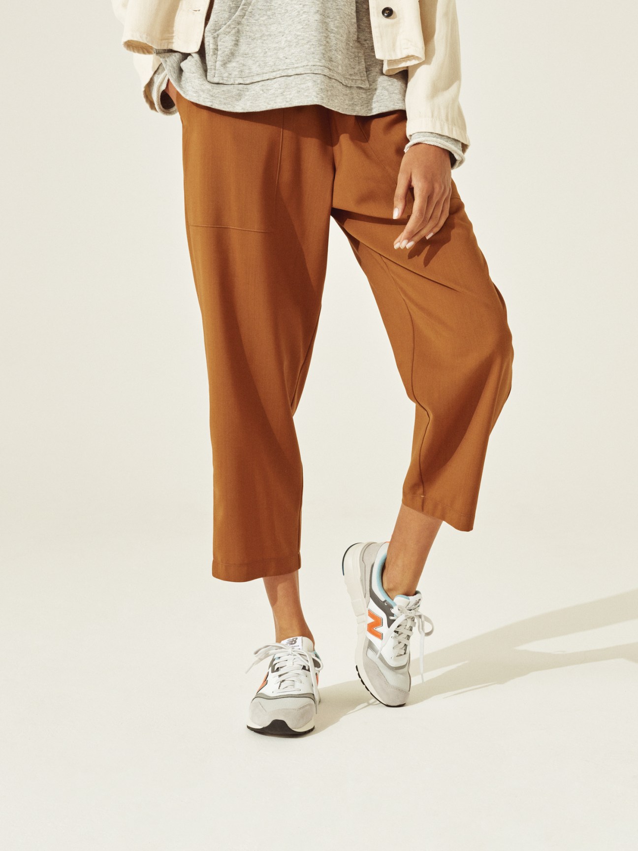 Model wearing Woolrich coat, Oyuna pullover and culottes, and Novesta trainers.