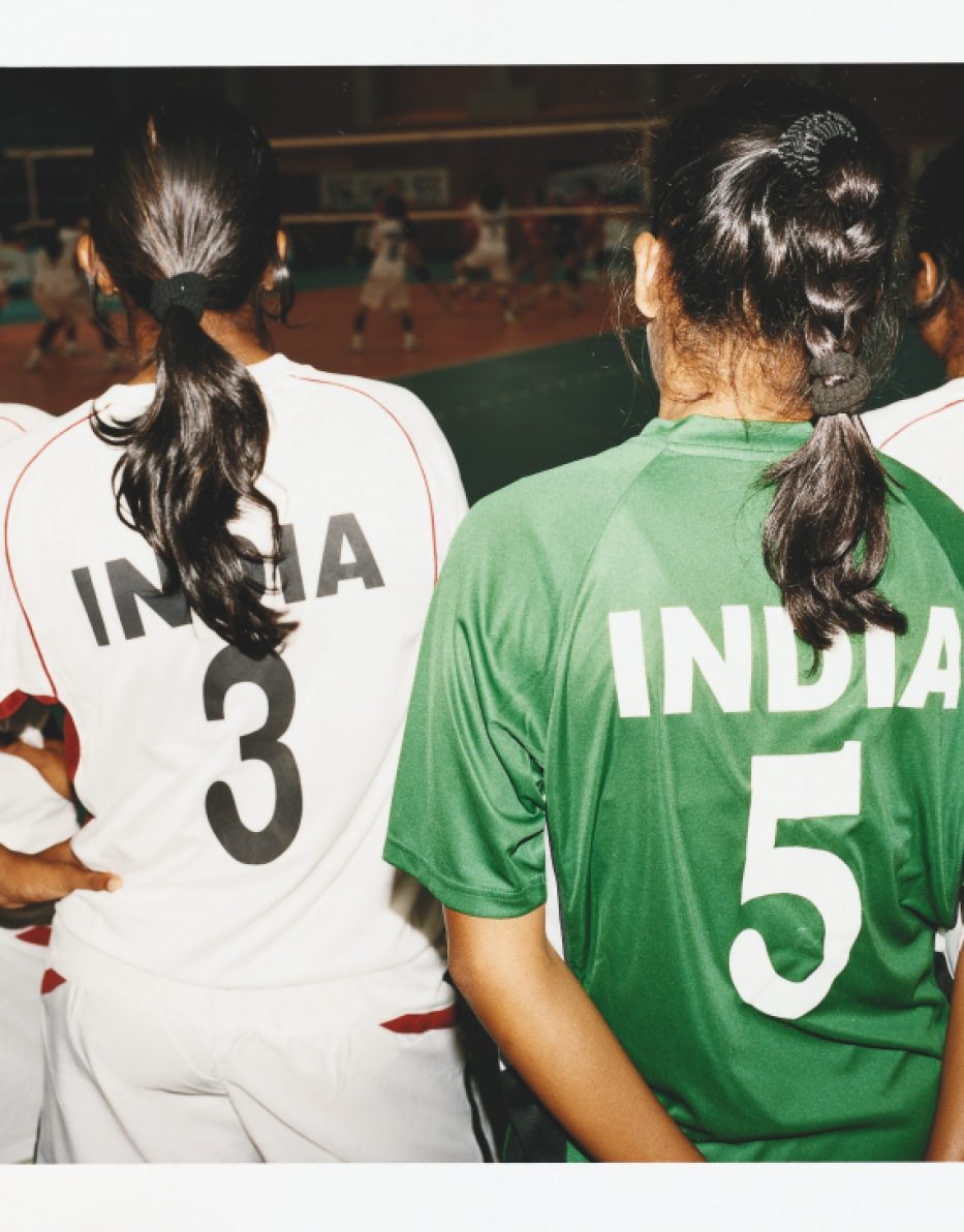 Indian women's volleyball team members wearing green and white uniforms with their jersey numbers visible.