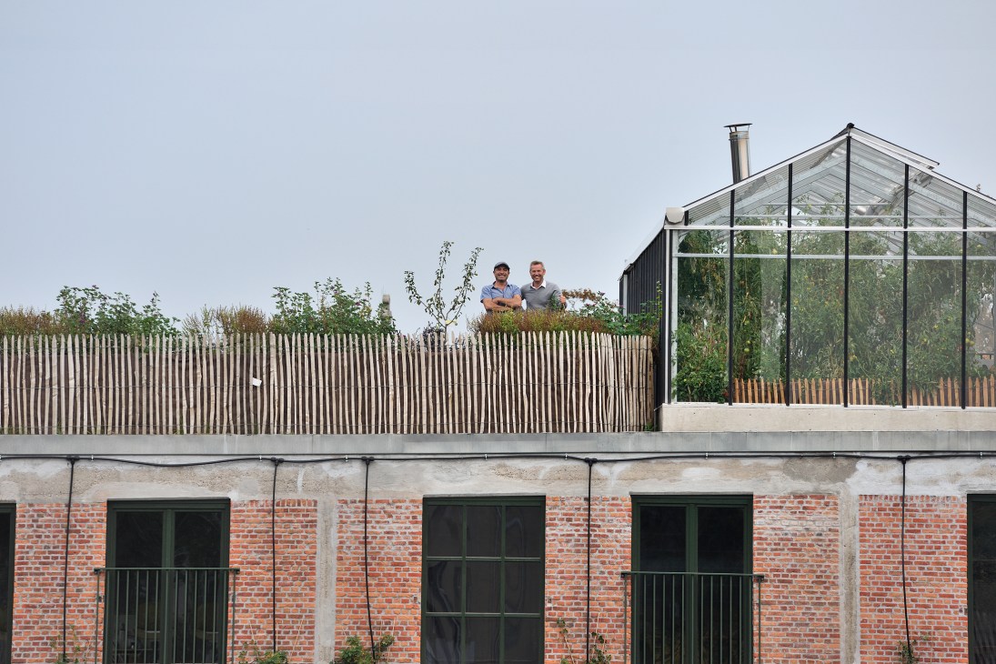 Stefan Bostoen and Yusuf Yaman standing on a rooftop garden overlooking the Pakt development