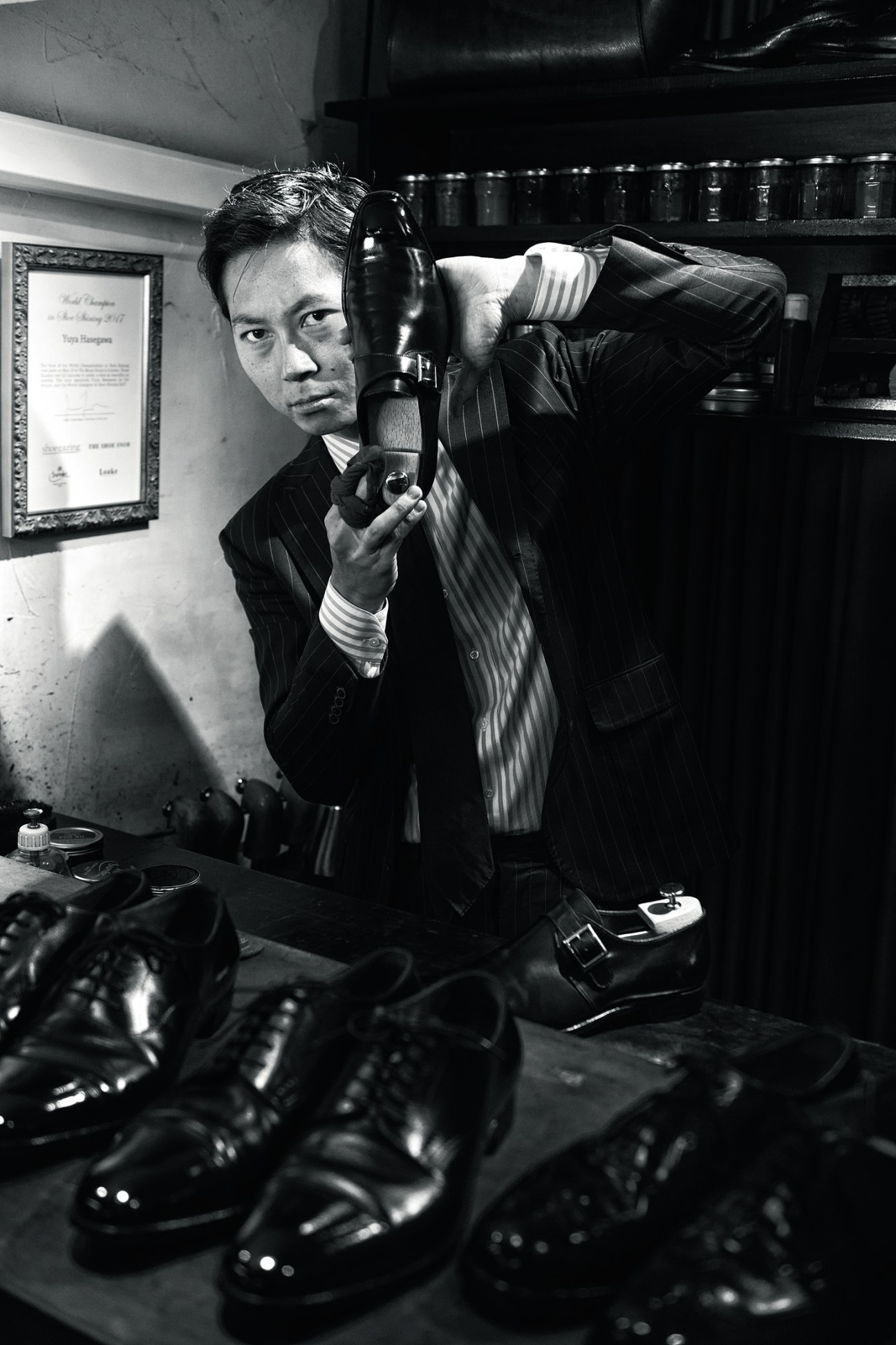 Portrait of Yuya Hasegawa, world shoe-shining champion in his Aoyama boutique