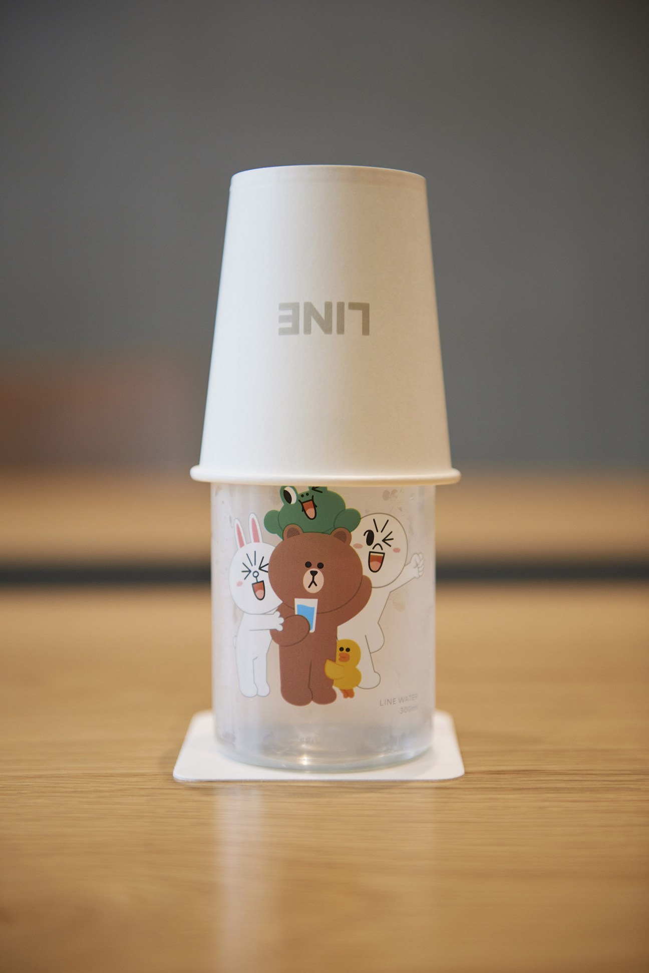 Line-branded water cup featuring cartoon characters including Brown the bear, Cony the rabbit, and other mascots.