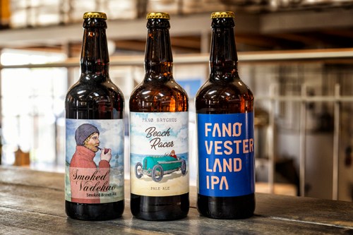 Three beer bottles from Fanø Bryghus brewery with different labels including Smoked Nordkyst and Fanø Vesterkyst IPA