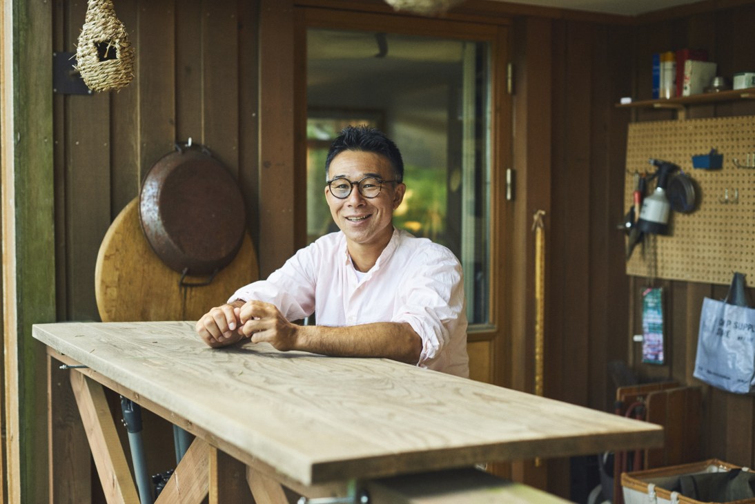 Shoichiro Aiba, owner and chef of Tokyo restaurant Life, poses at a wooden counter in his Sweden House in Nasu.