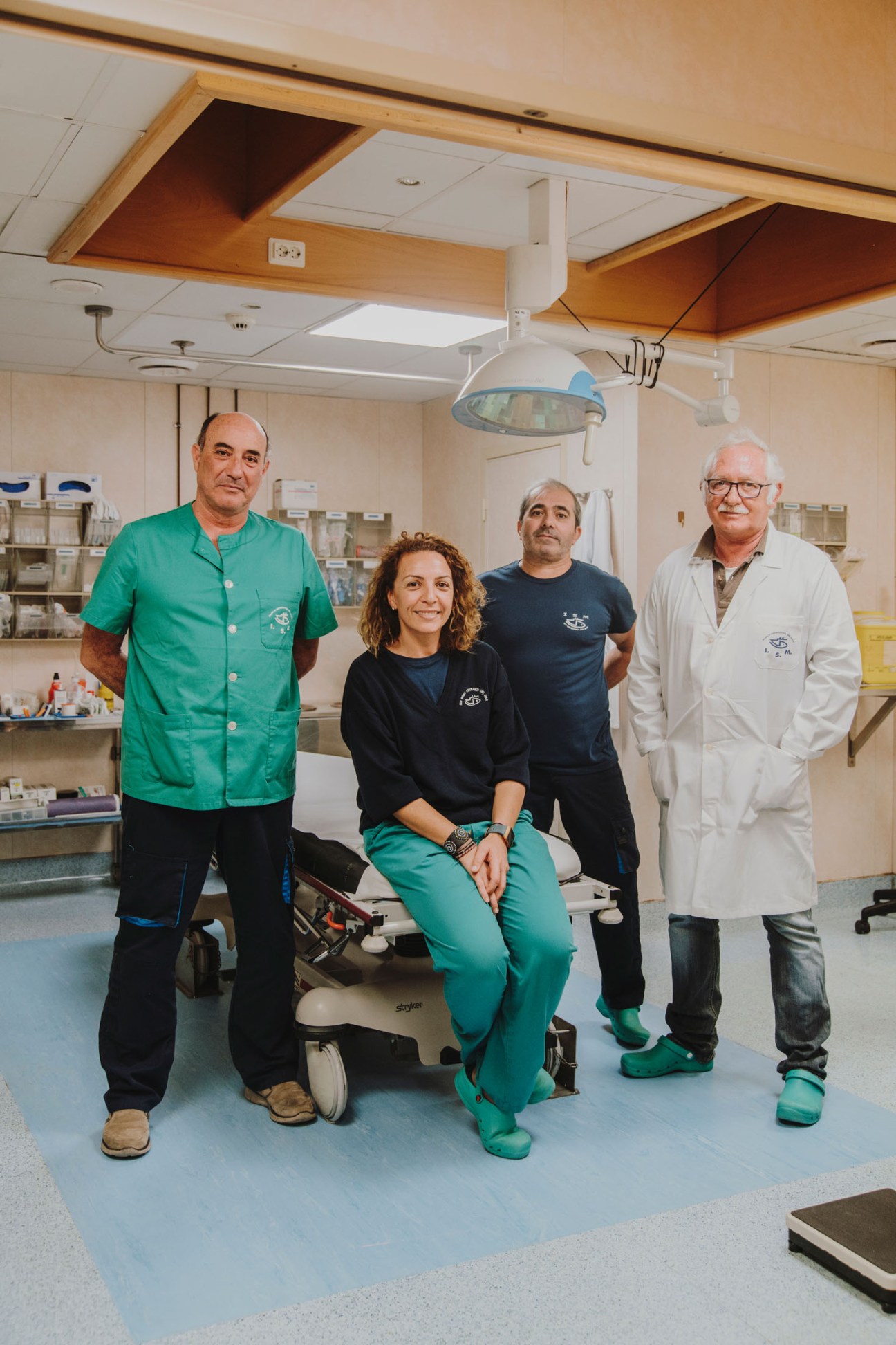 Four medical staff members in a hospital operating room on the Esperanza del Mar ship.