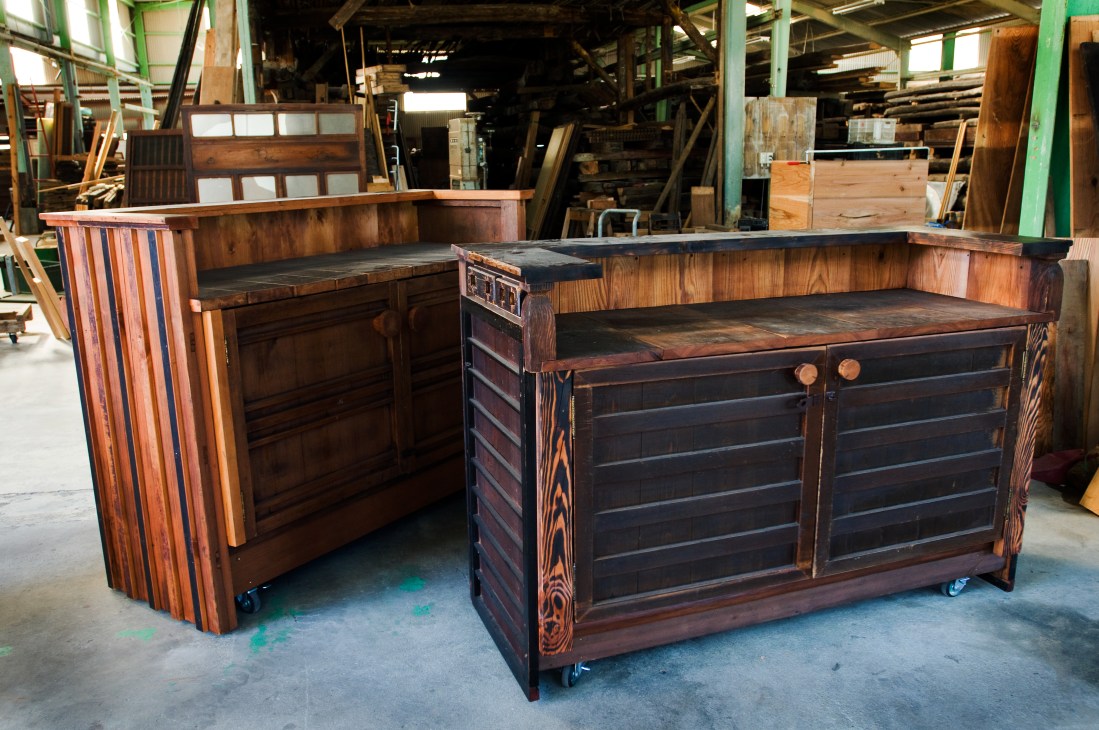 Wooden furniture crafted from antique doors in a warehouse, made for Robert De Niro's Greenwich Hotel spa.