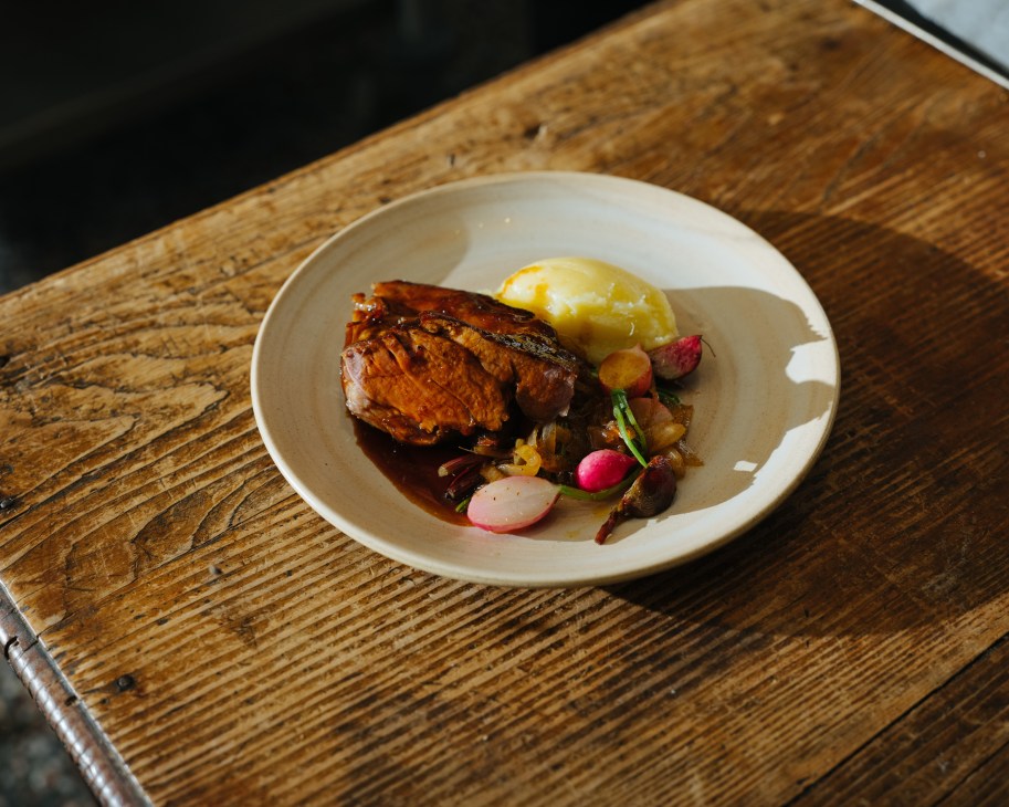 Lamb dish served with radishes