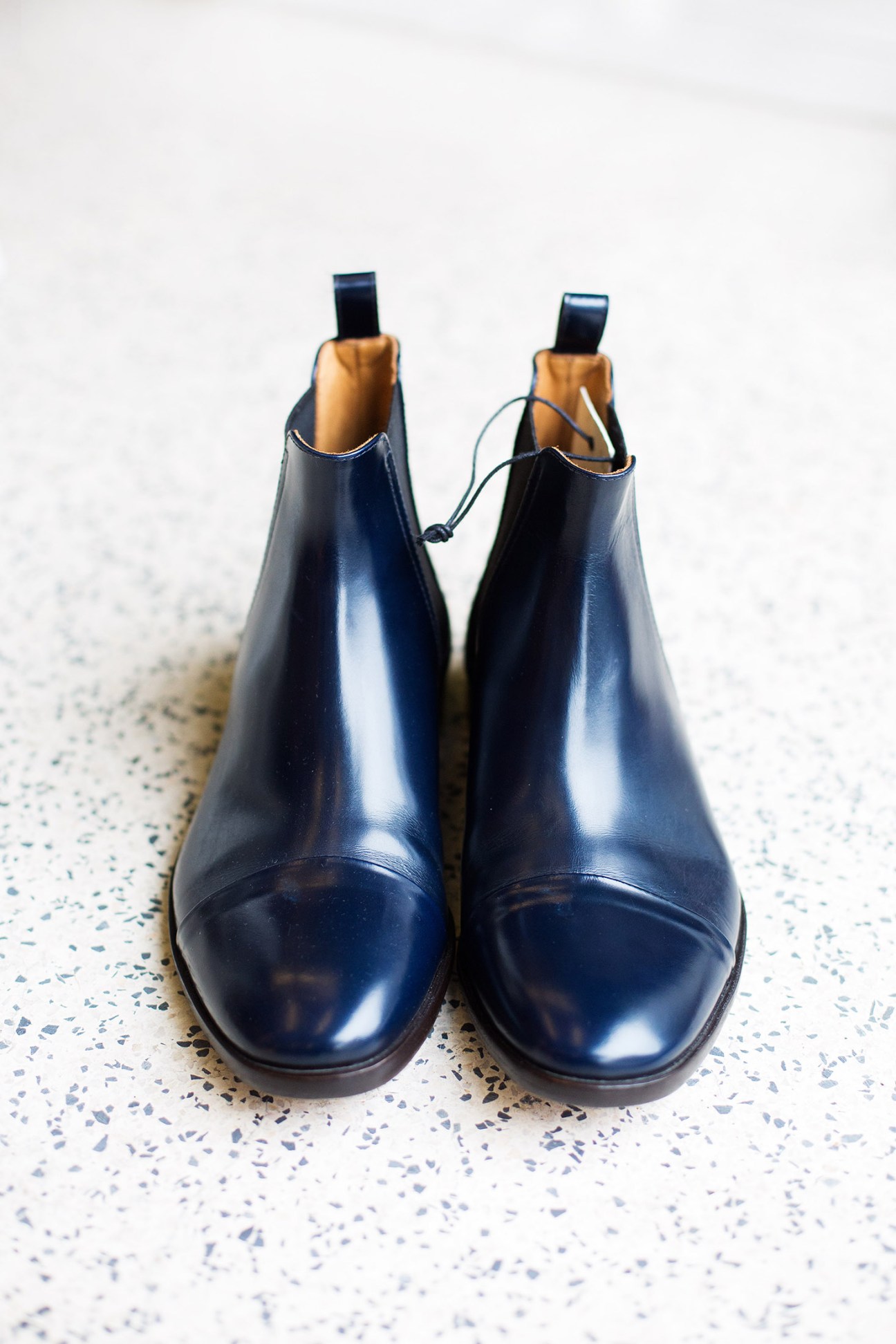 Pair of black leather Chelsea boots with tan suede lining by Armando Cabral.