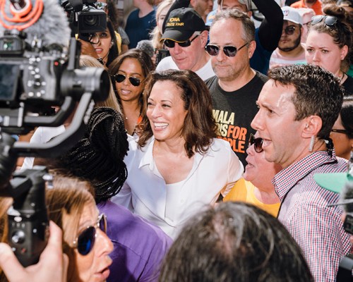 Kamala Harris surrounded by media and supporters at Iowa State Fair