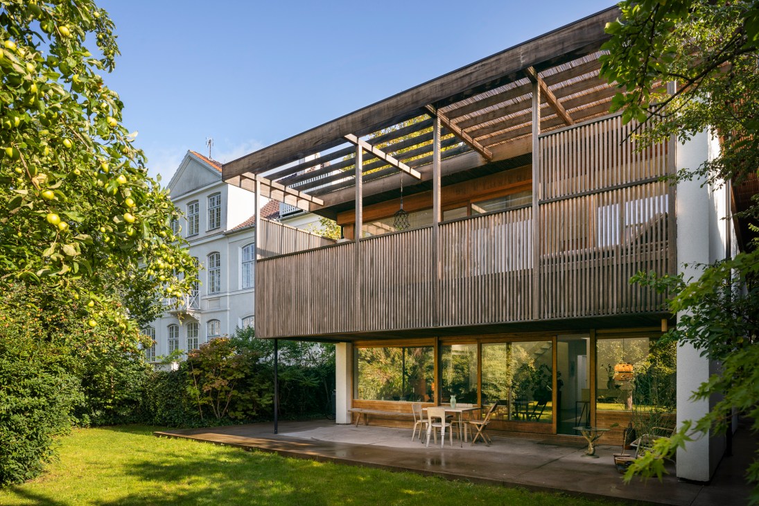 Exterior view of 1970s Copenhagen house showing warm mahogany timber cladding and Japanese-inspired architectural details