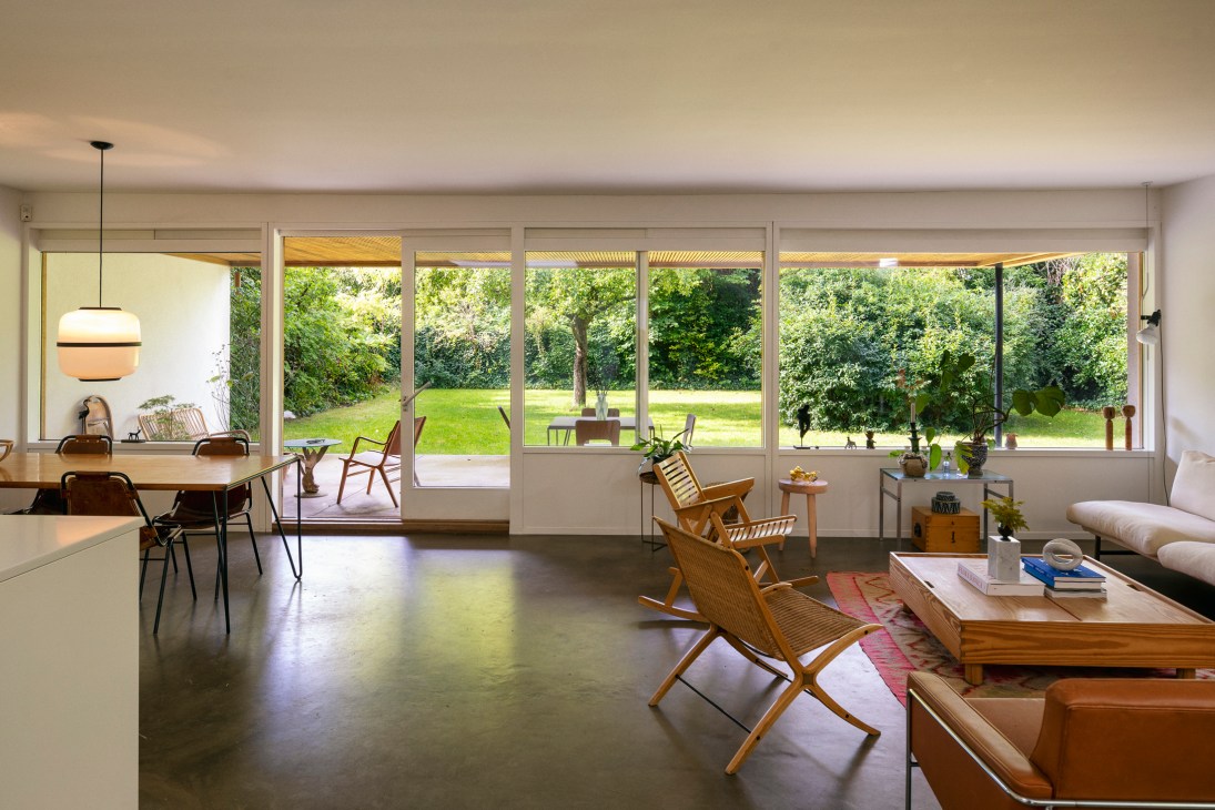 Ground floor sitting room with high ceilings, wooden beams and direct access to garden