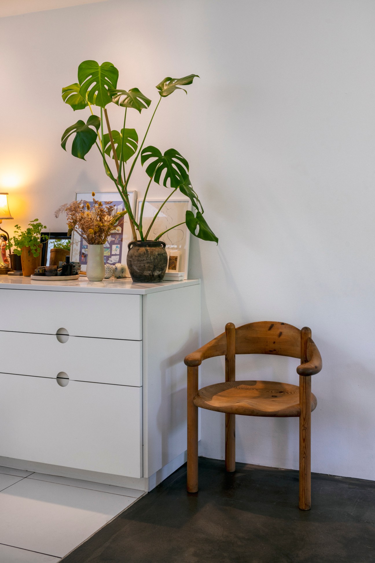 Upper floor reading nook with built-in seating and large windows overlooking the garden