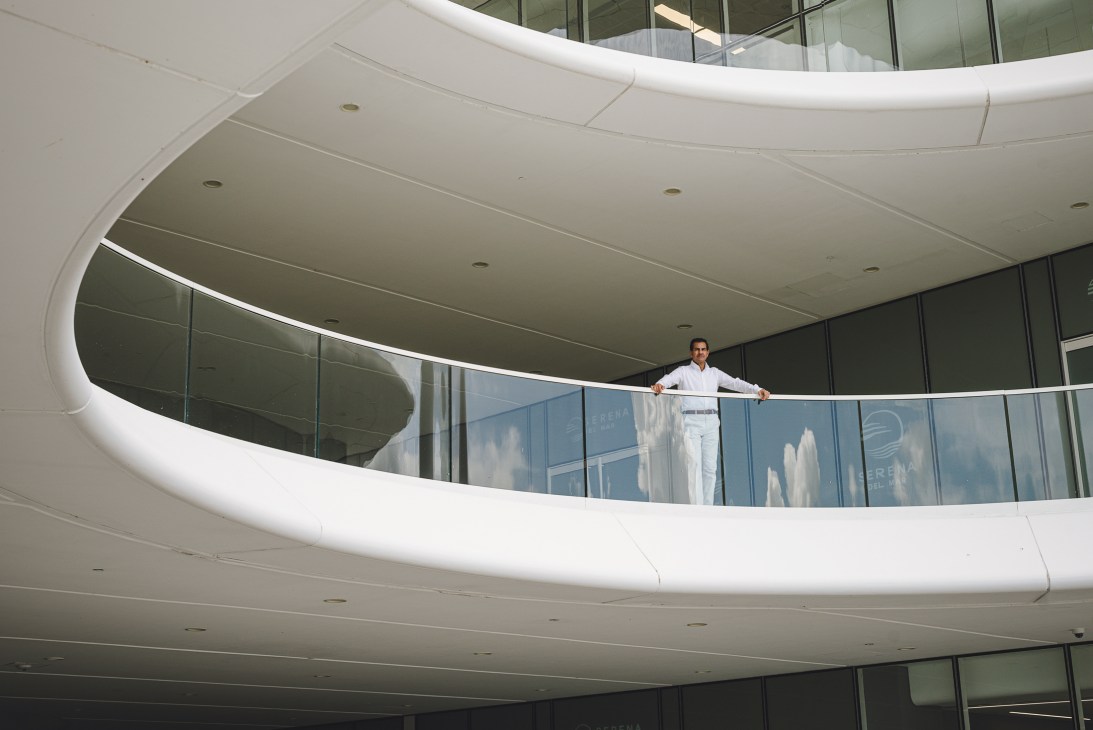 Daniel Haime surveying Serena Del Mar from the balcony of the Los Andes University campus, designed by Brandon Haw
