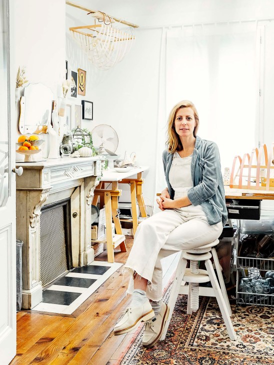 Belgian-born designer Mieke Mertens sits in her bright, minimalist atelier filled with handmade lampshades and vases.