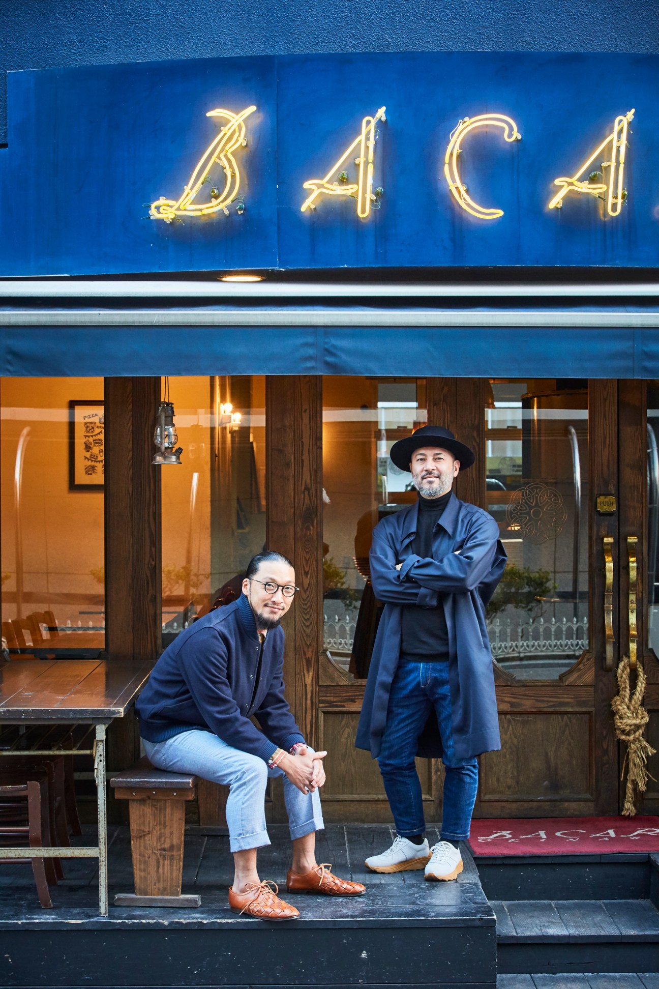 Dapper chefs at pizzeria Bacar, owner Daisuke Nakamura and Chikara Matsumoto posing outside restaurant