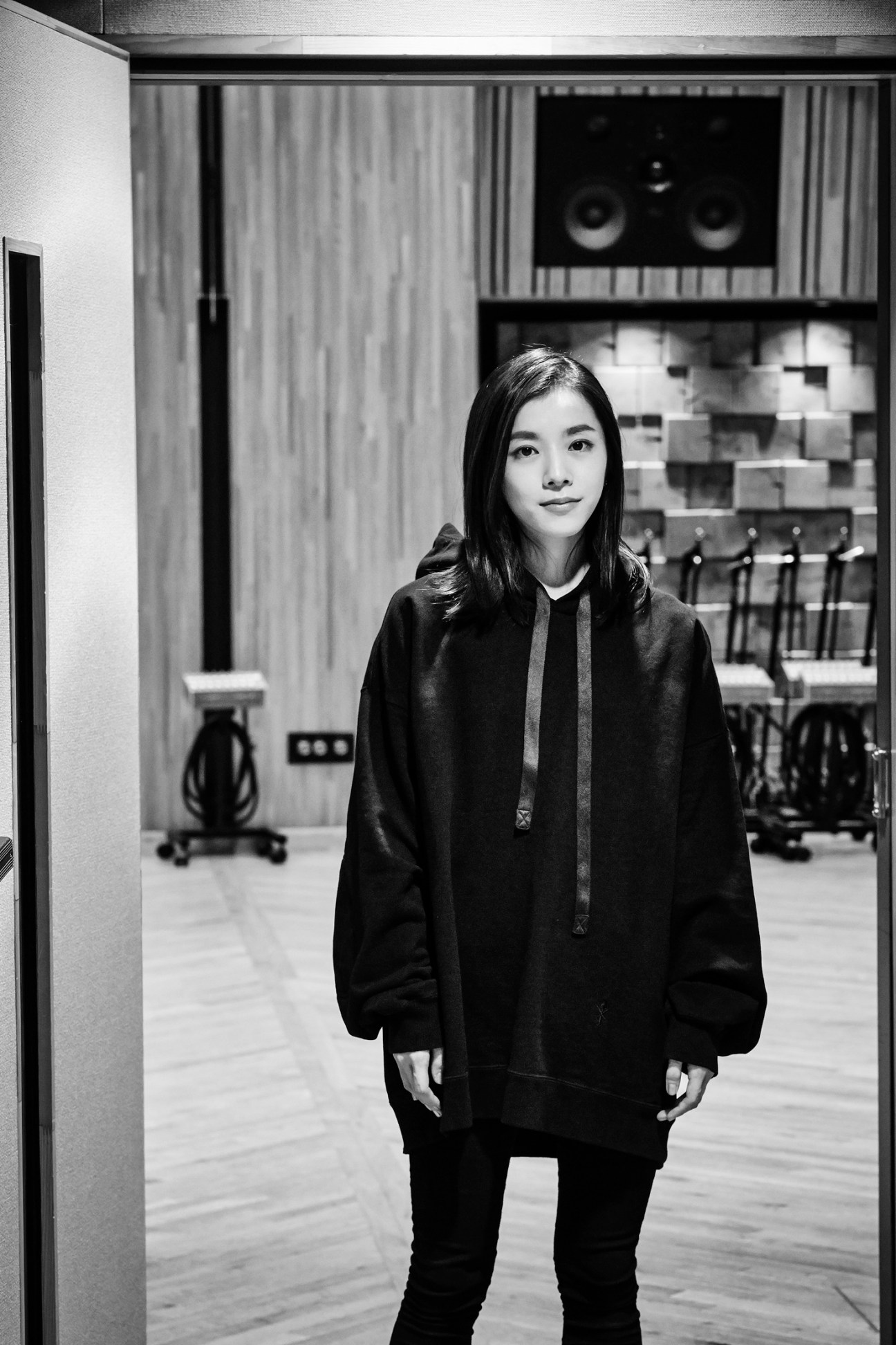 Portrait of Milet, an emerging singer-songwriter in a recording studio