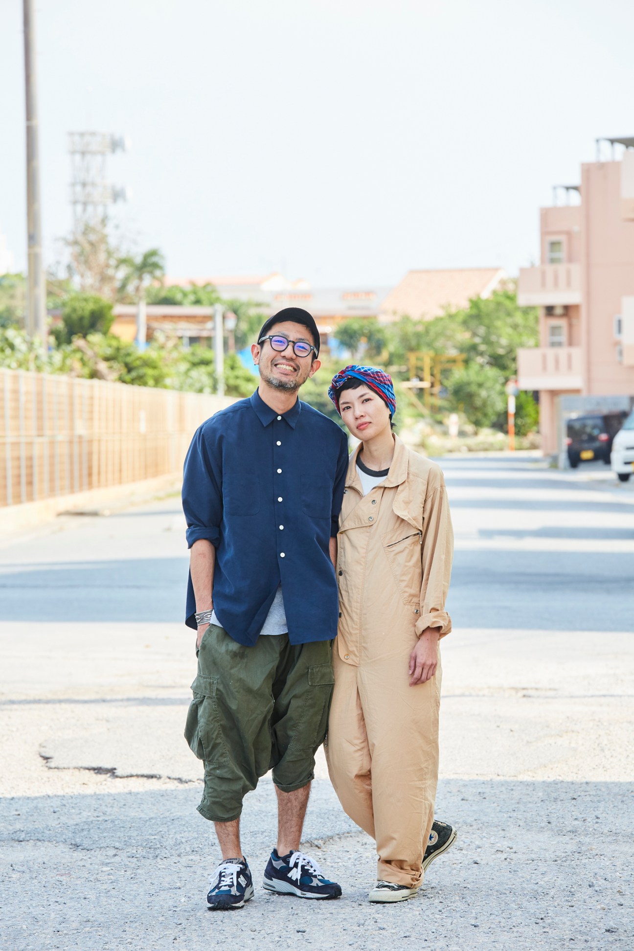 Satoshi and Chihiro Shiohira standing together on a street in casual clothing