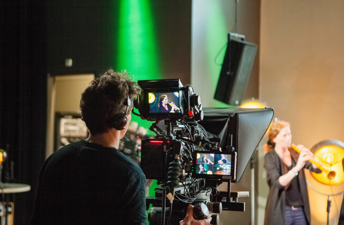 Cameraman filming a musician performing during VPRO's Free Sounds television production.