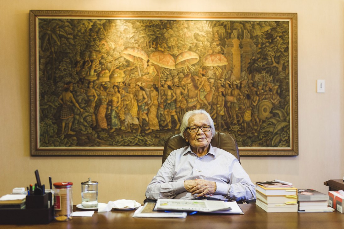 Jakob Oetama, founder of Kompas newspaper, seated at his desk in Jakarta.