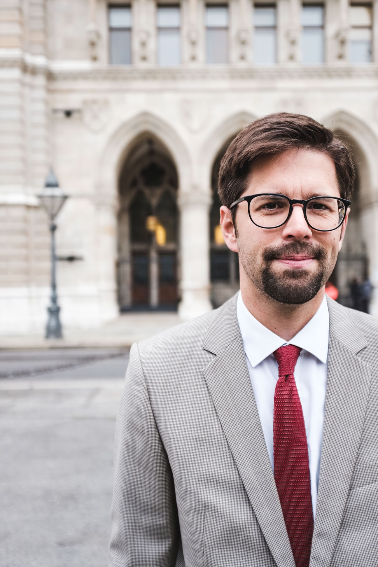 David Vladar, project manager for Vienna's mobile-mapping initiative, stands in front of a historic Viennese building.