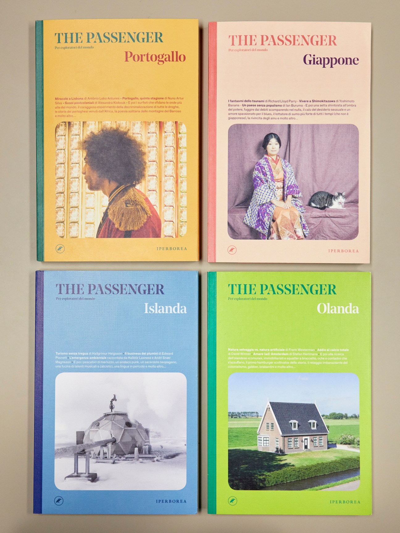Four colorful travel guide books from The Passenger series featuring destinations Portogallo, Giappone, Islanda, and Olanda