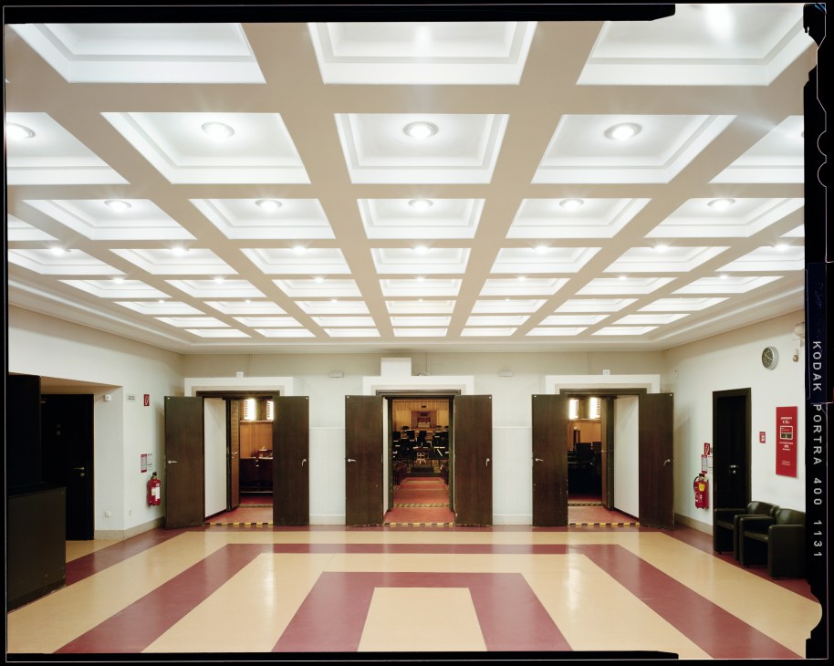 Interior lobby with coffered ceiling, recessed lighting, and geometric floor pattern in Vienna's Funkhaus